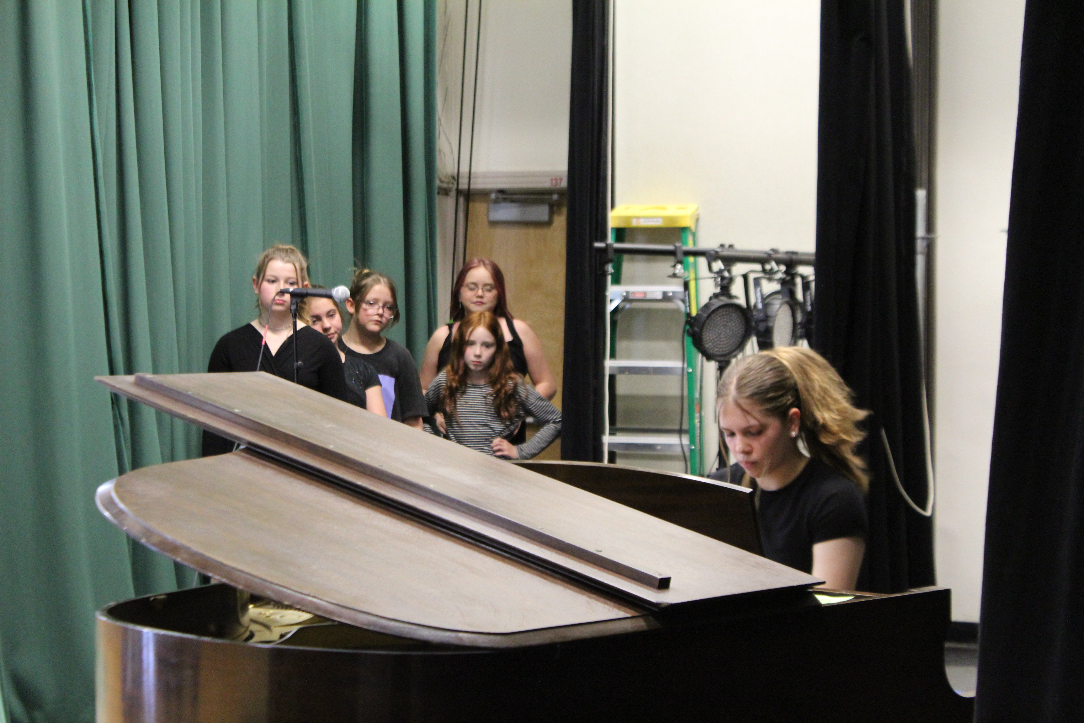 Students watching piano performance