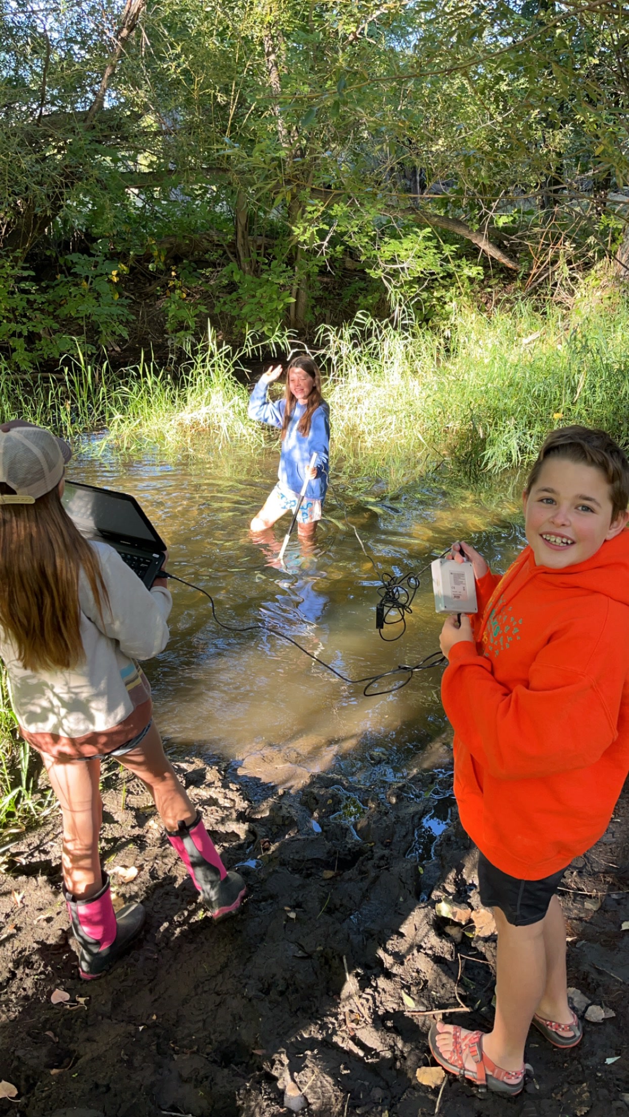 Students testing Poudre River water