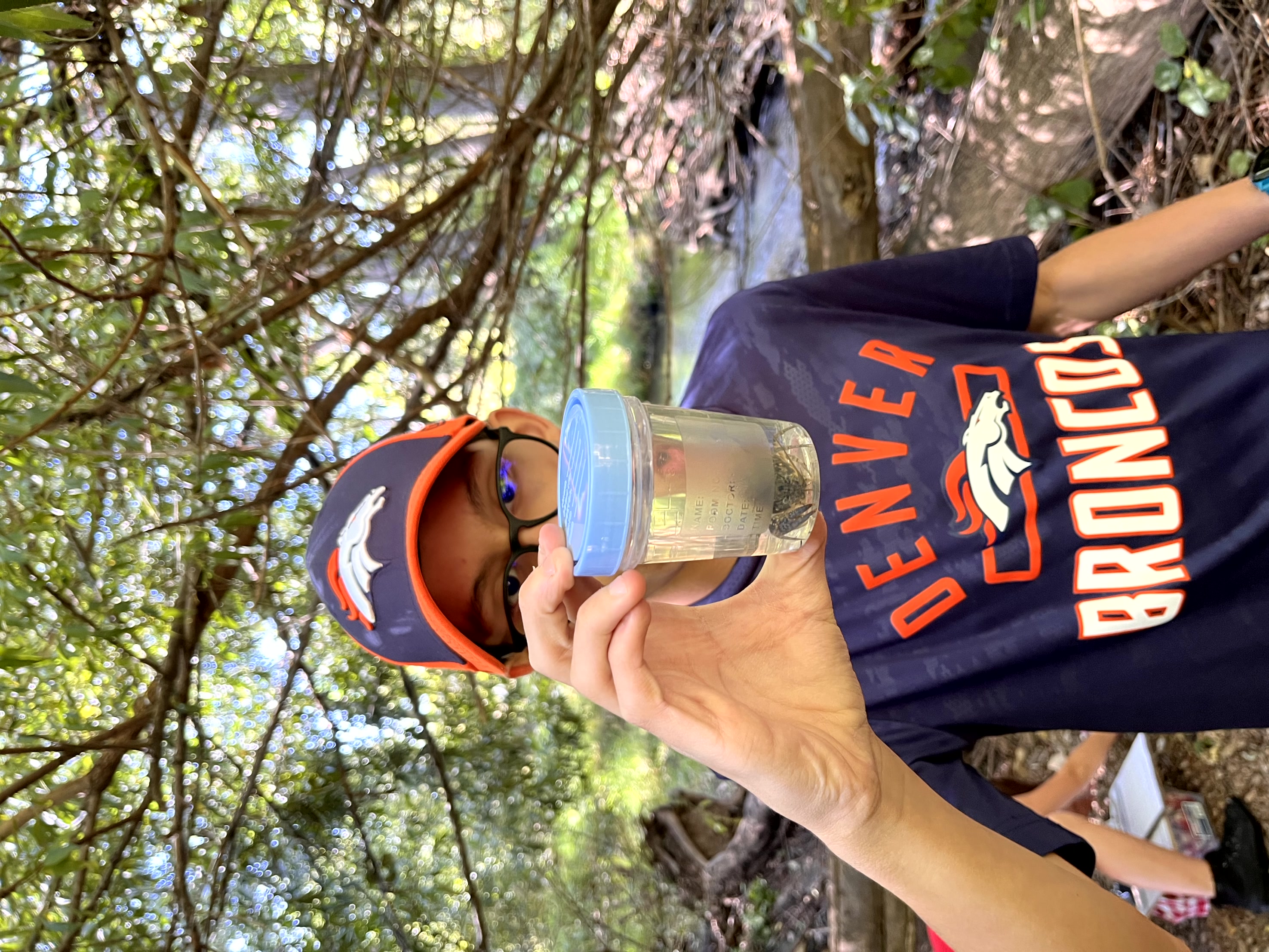 Student investigating creatures from the River